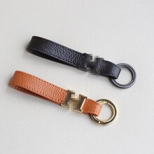 Leather keychain key rope anti-lost double buckle metal handmade creative pendant key bag gift giveaway